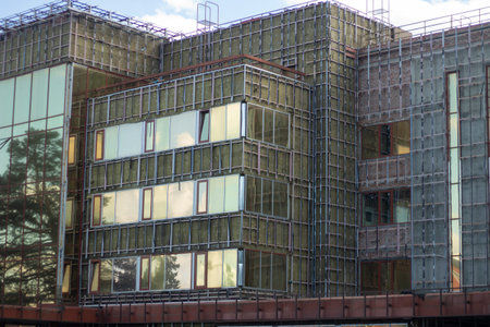 An office building. Modern architecture. A building with large mirrored windows. View from the...