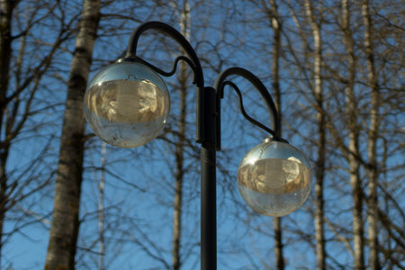Street lighting during the day. Lighting in the park. Stand for light bulbs.の写真素材