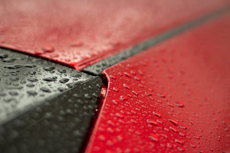 Parts of a wet car. Drops on the surface of the machine. Car after rain.