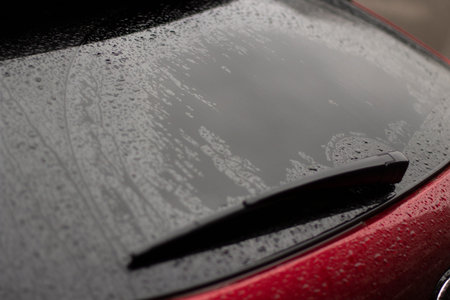 Parts of a wet car. Drops on the surface of the machine. Car after rain.