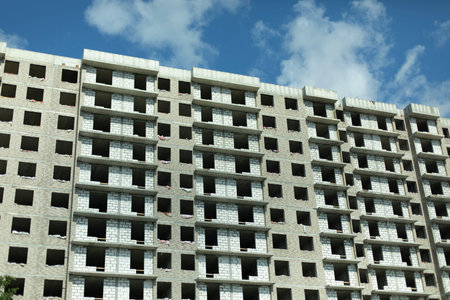 House under construction. Multistorey building. Big construction in the city. Unfinished...
