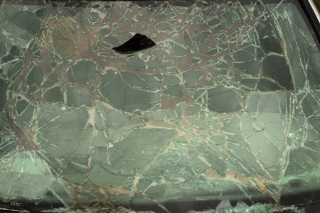 Broken glass in detail. Car windshield after the accident. Lots of small pieces. Texture cracks.