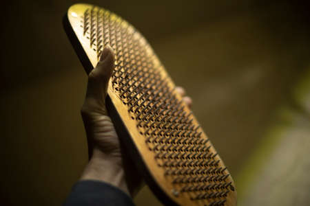 Board with nails. Tool for practicing yoga. Small nails stick out of board. beautiful item.の写真素材