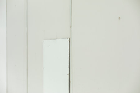 patch on wall. Texture of white wall with inserts. broken surface. vandalism.の写真素材