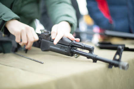 Cleaning Firearms Military Lesson in Russia. Children learn to wild guns. Details of training in army.の写真素材