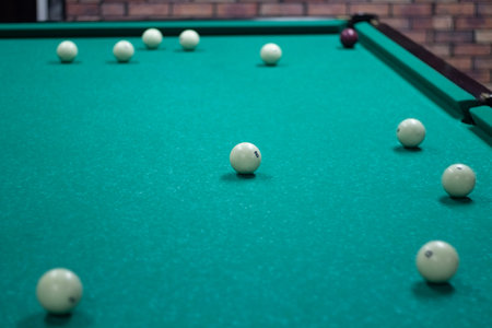 Billiard balls are white. green billiard table. playing in bar. sports competition. Balls rattled...