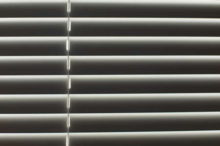 Blinds on window. Leakage of blinds. Window in the afternoon. protection from light.の写真素材