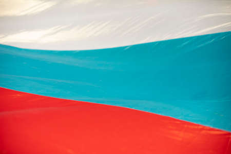 Russian wave flag. Fabric in colors of state flag of Russian Federation. White, blue and red stripes.の写真素材