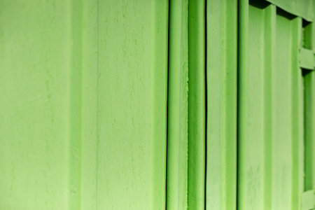 Texture of steel fence. Wall of building. Bright colors in architecture. reflective surface.