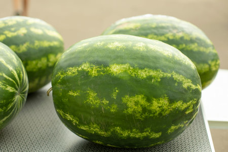 Watermelon table. Juicy fruit. Harvest in summer. greenberry. Refreshments outside. Health food.