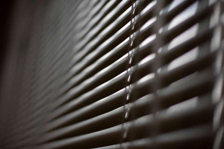 Blinds on window. White blinds cover window from sun. interior details. shooting diagonally.の写真素材
