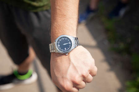 A man with a wristwatch on his hand. Close-up.の写真素材