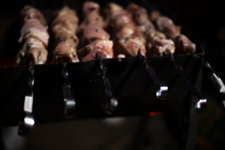 The meat is fried over an open fire. National cuisine of the Caucasian peoples. Delicious meat gives...