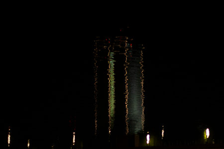 Reflecting the building in the water at night. urban lighting. water at night. dark background....