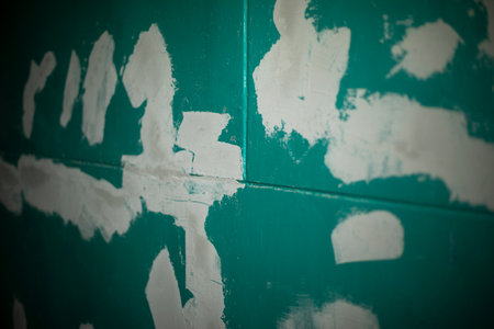 repair wall. paint on wall. Surface Finishing Details. White spots on green background.の写真素材