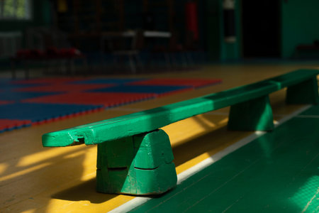 Shop in the gym. old gym. Green bench made of wood. seating area.