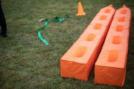 sports equipment. Orange sports equipment. Item to play with. Things on site.の写真素材