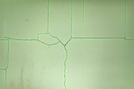 Cracks on wall. Scratches on green background. old paint. surface crack.の写真素材