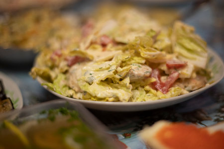 Salads on table. Russian festive table. Delicious food. Dinner on plates.の写真素材
