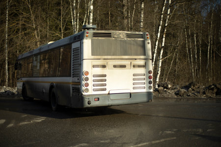 Bus at turn. public transport in the city. car on road.の写真素材