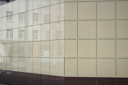 Wall of building. Modern house. Beige tiles. house cladding.の写真素材