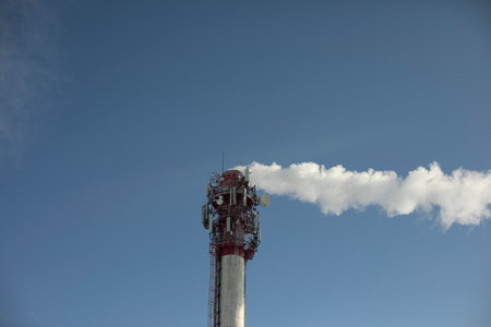 Boiler station pipe. Smoke from chimney. industrial zone. Steam removal from plant. high tower.の写真素材