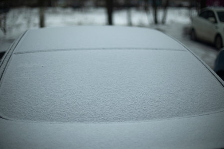 car in snow. Glass of car in snow. Transport in parking lot in winter. parking details.の写真素材