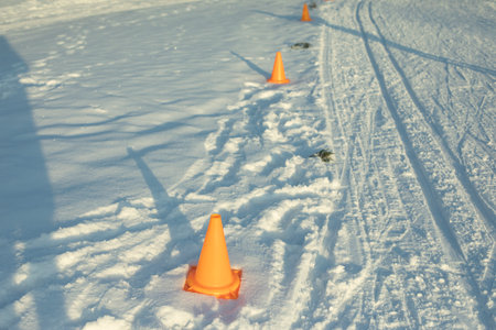 Ski tracks for competitions. Rolled snow. Track details in mountains. Sports relay in winter.の写真素材