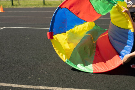 Sports equipment in summer. Colored fabric. Ring for soprive relay. Details of fun on playground.の写真素材