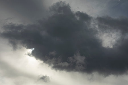 cloud obscure sun. gray sky. cloudy weather. Tragic sky over forest.の写真素材