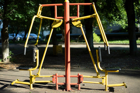 Sports simulator on street. Sports ground in yard. Equipment for training in city. muscle strengthening machine.の写真素材