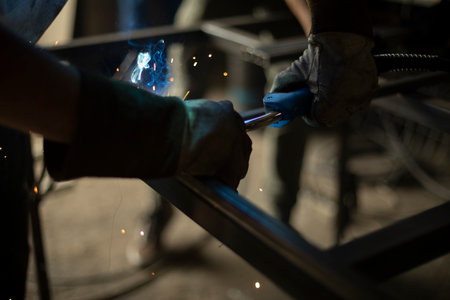 metal welding. High temperature steel. Iron seam welding. work in garage. Creation of structure.の写真素材