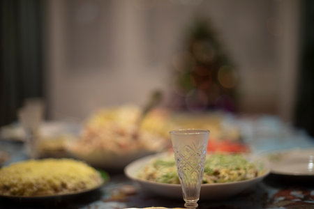 Glass of vodka on table. Festive table. Glass for alcoholic beverages. Russian feast.の写真素材