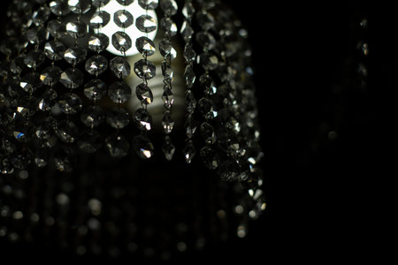 Chandelier in the room. Crystal chandelier interior. Light in dark room. glass elements.の写真素材