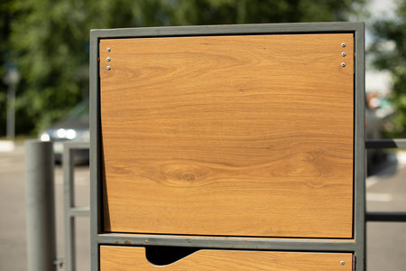 Garbage box on street. wooden box. Waste disposal door. outdoor furniture.の写真素材