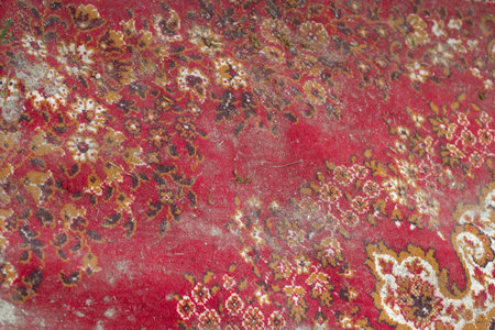 Carpet in mud. Dust on coating. Homemade carpet in Persian. interior details.の写真素材