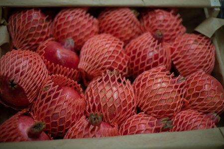 pomegranate market. Fruit box. Fruits in net. market details. Packed food.の写真素材