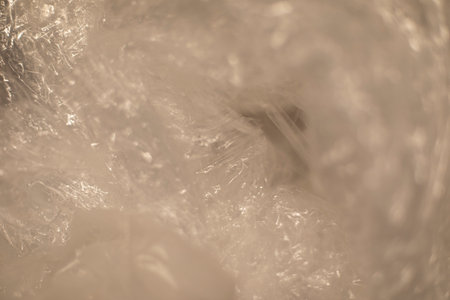 Texture of plastic. Packaging film in detail. transparent material. Crumpled film.の写真素材