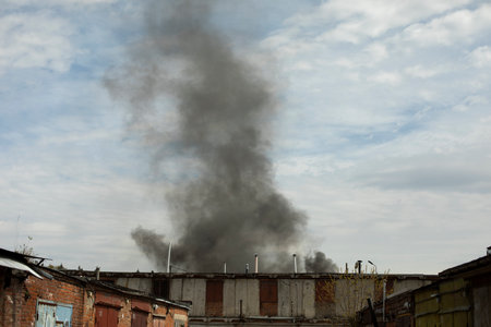 Burning of building. Smoke over buildings. smoke in the sky. extreme situation.の写真素材