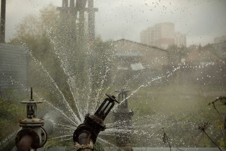 pipeline accident. Water pours out of pipe. emergency. Breakdown at boiler room.の写真素材