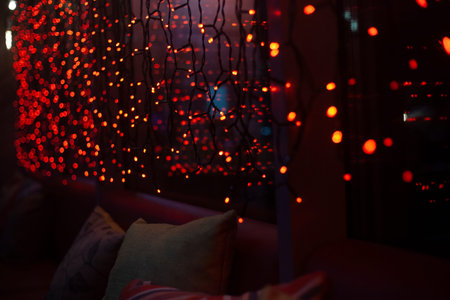indoor garlands. light in room. Interior detail. light red.