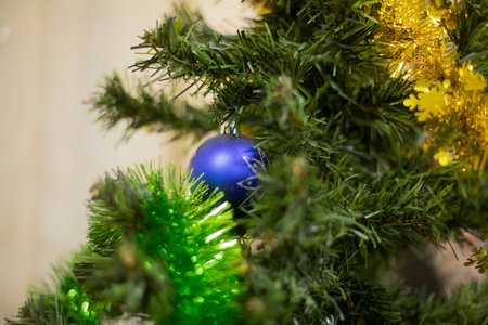 Blue ball on Christmas tree. New decoration on spruce. Festive details.の写真素材