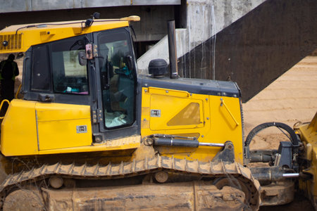 construction site. Heavy machinery at the construction site. Construction among the sand. An...
