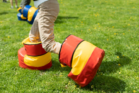 Funny shoes for game. Fun holiday of child in summer. Entertainment on green grass. playing on lawn....