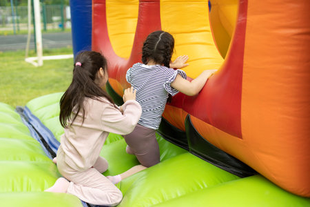 Child on obstacle course. children's entertainment area. Inflatable design for kids.