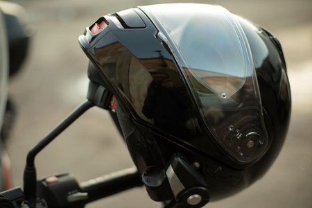 Motorcyclist helmet. Black helmet on motorcycle. security tool. head protection.の写真素材