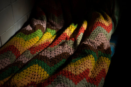 old plain. Blanket in detail. Woven thread. Colored bedspread. Quilted cloth.の写真素材