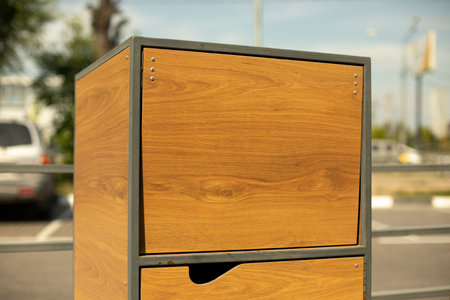 Garbage box on street. wooden box. Waste disposal door. outdoor furniture.の写真素材