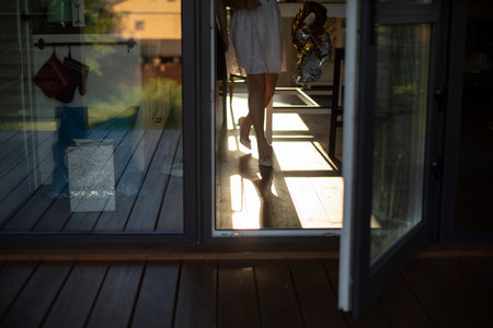 Open door to house. Glass doors on ground floor. interior details. plastic white door.の写真素材