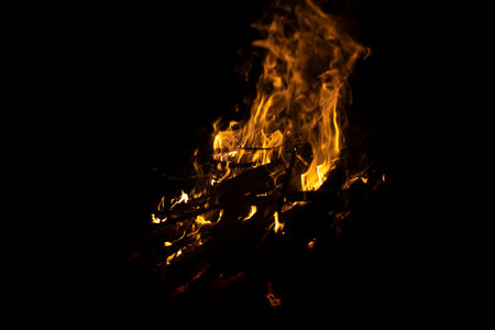 Bonfire in dark. Fire on black background. Details of flame. burning dry branches.の写真素材